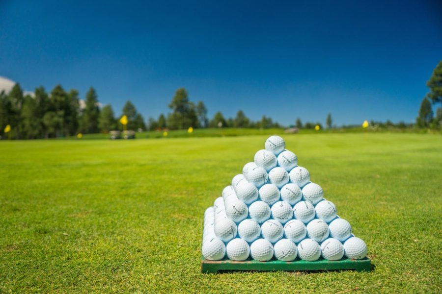 A+pyramid+of+golf+balls+stacked+up+on+the+driving+range