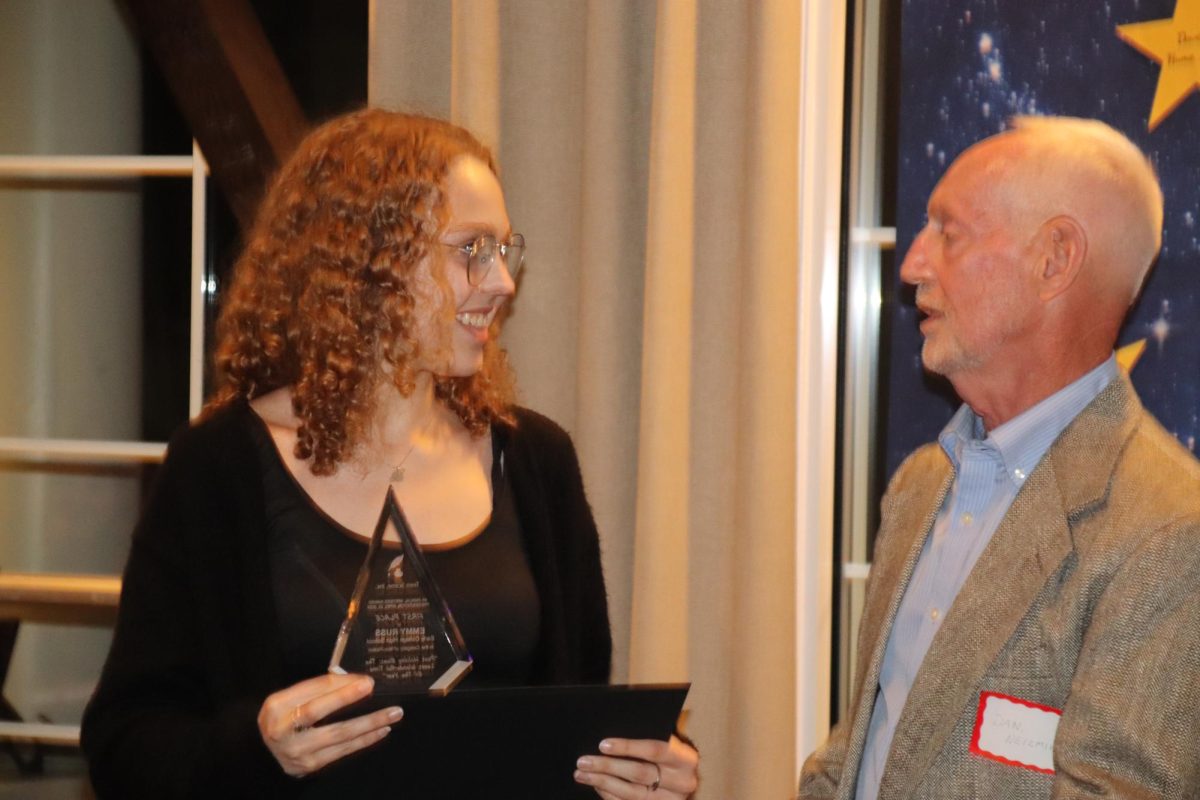 Emmy Russ accepts her award from Dan Niezmik