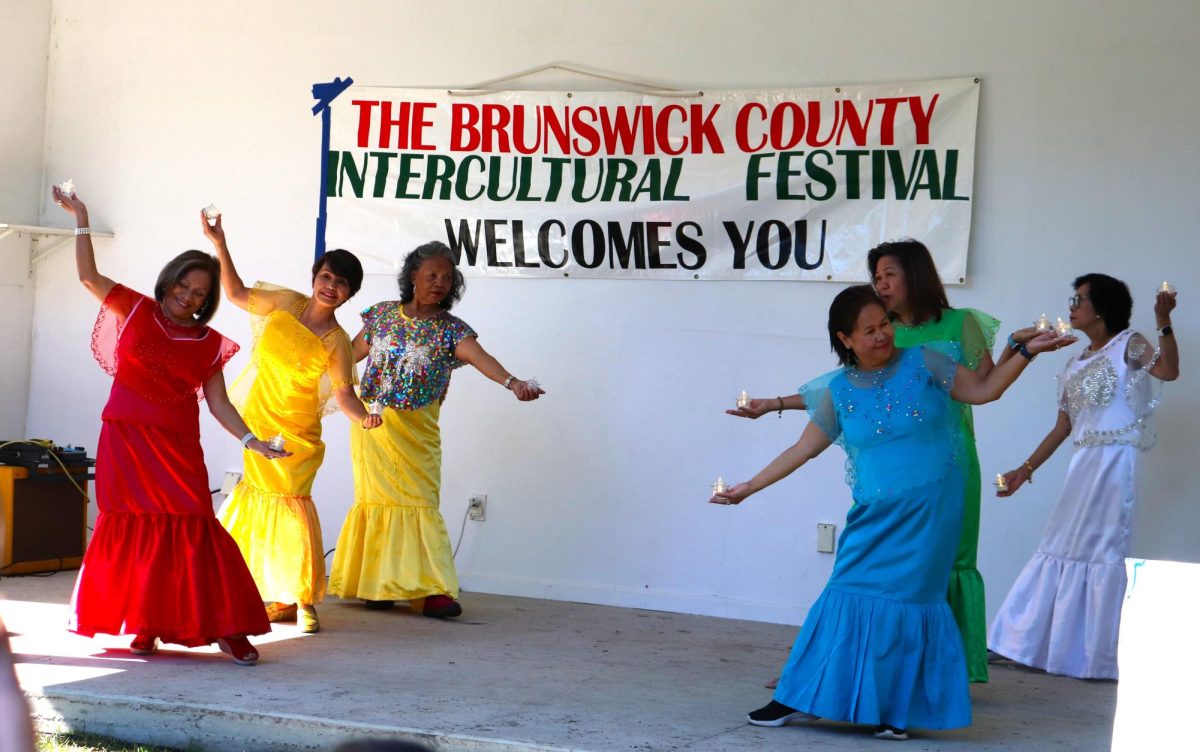 Ladies from the Philippines doing a traditional candle dance 