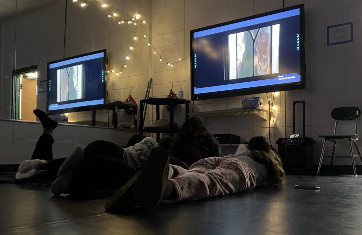 Students watching a movie on the last day of classes before exams.